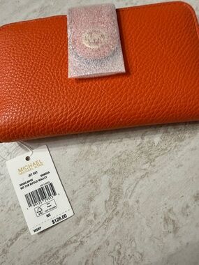 MICHAEL Michael Kors Orange Pebbled Leather Jet Set Continental Wallet..